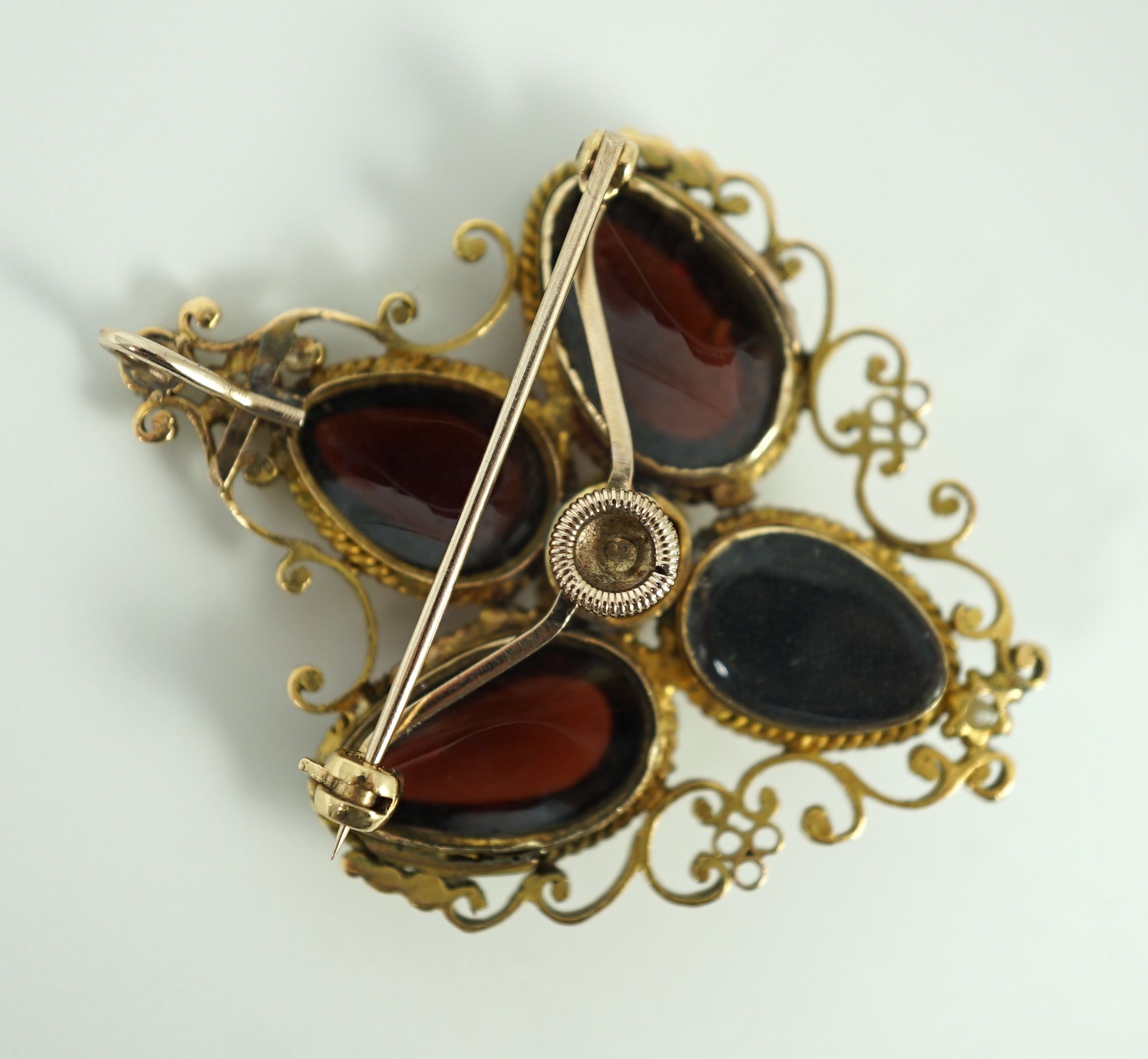 A Victorian gold, four stone garnet and three stone split pearl set mourning pendant brooch